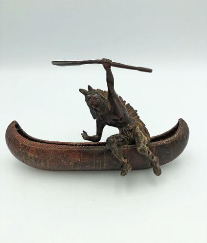 Indian Exiting Canoe with Oar in Hand